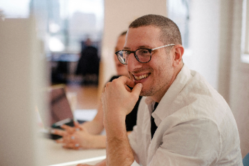 Happy man representing positive experience and trust in our analysis services