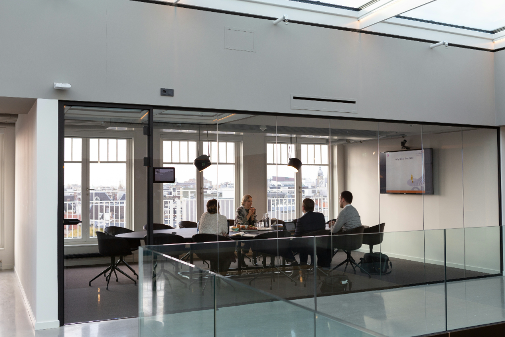 rodeo-project-management-software-ONe-snuCaqQ-unsplash Professionals working in an office representing practical use cases for in-depth interviews